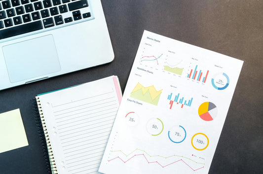 Desktop with printed graphs