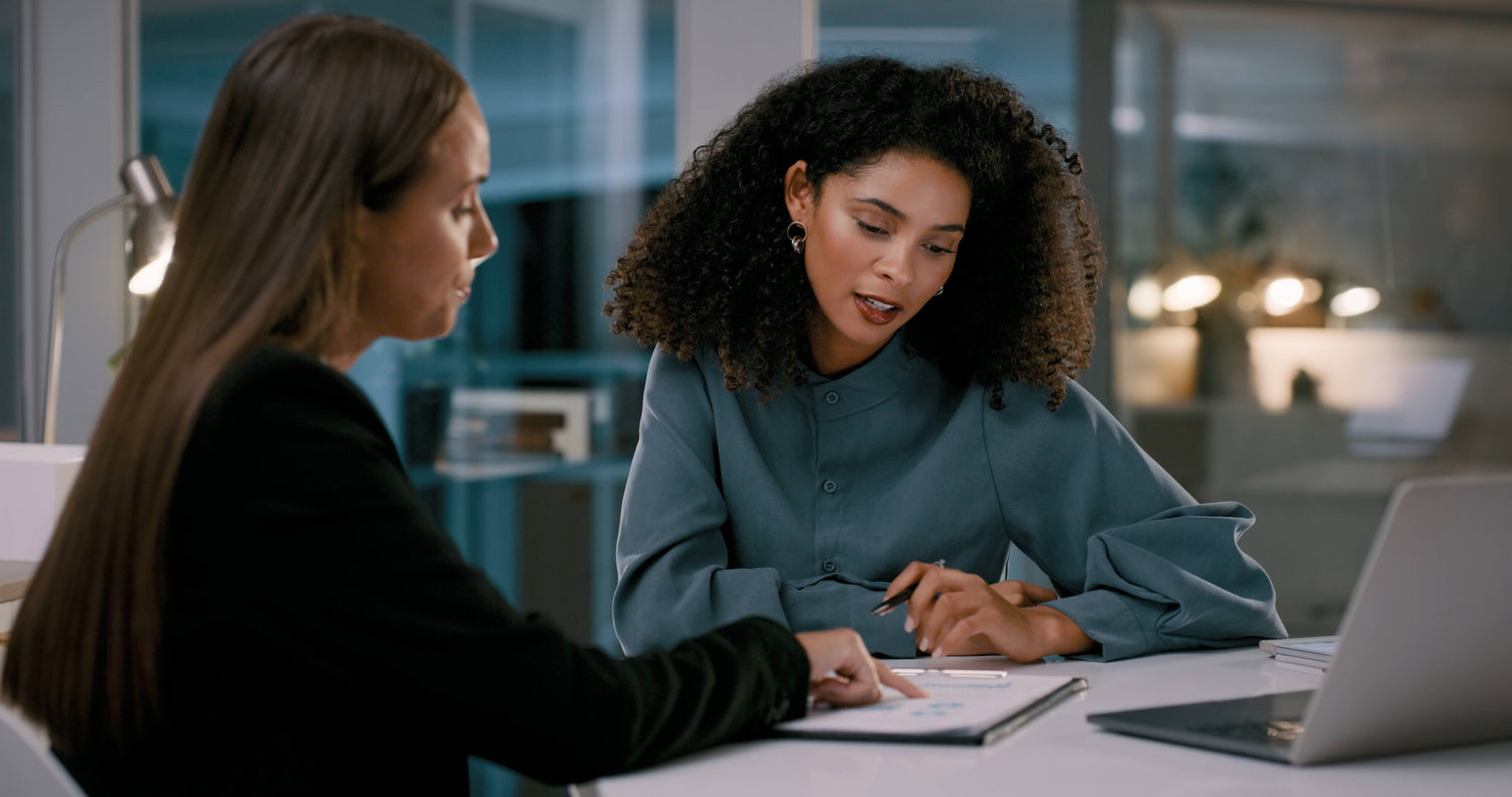 Two women working on their EPR report and discussing the results provided by ForSURE.