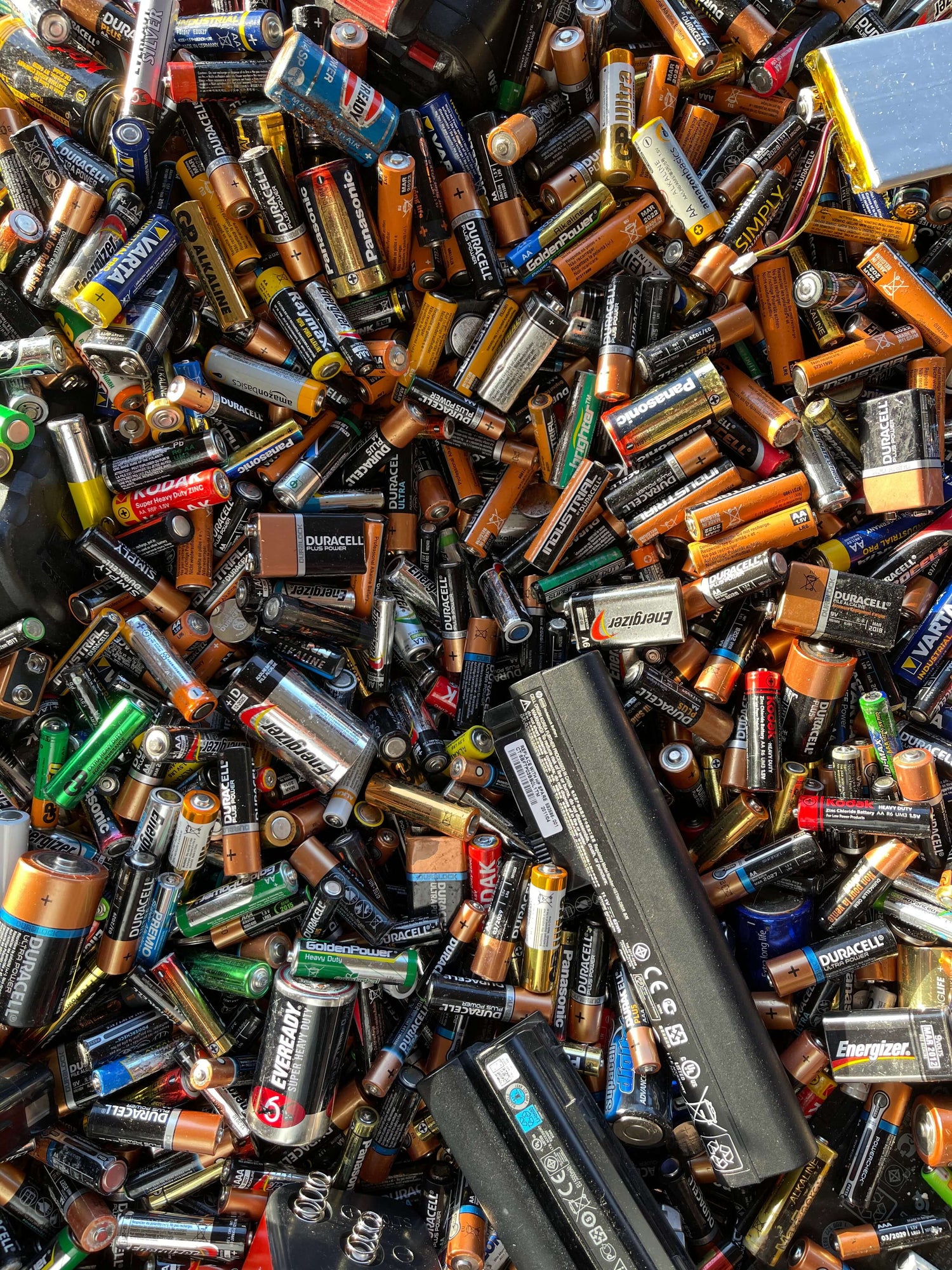 Pile of assorted batteries representing the importance of battery EPR reporting and the need for battery compliance software.